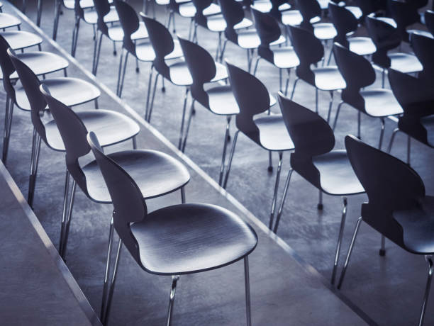istock Chairs in row Empty seats Seminar Business concept 694028504