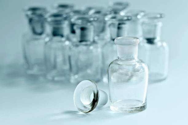 istock Vintage glass bottles for pharmacy bottles and science laboratory. 694029082