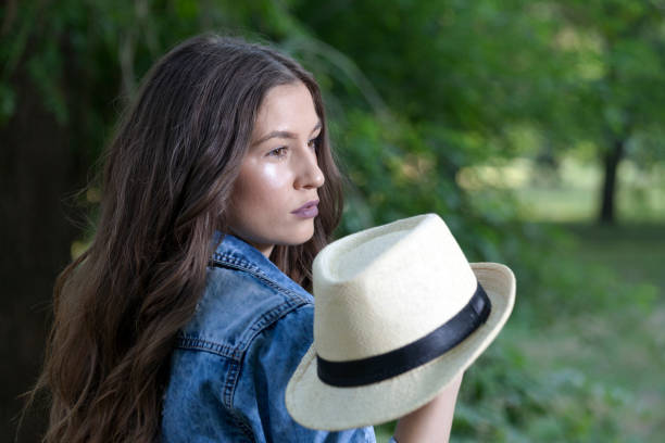 istock She holds  hat in her hand and goes 694029552