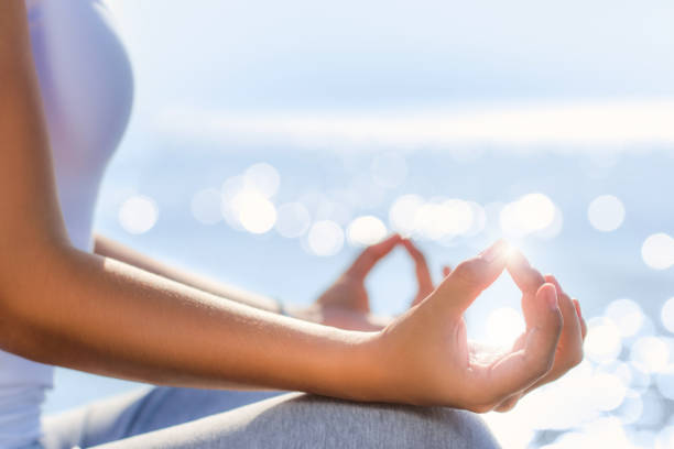 istock Conceptual yoga hands in morning sunlight. 694032592