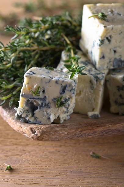 istock Blue cheese on a wooden table . 694032922