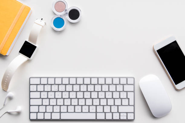 istock flat lay with computer keyboard, smartwatch, smartphone and office supplies 694035600