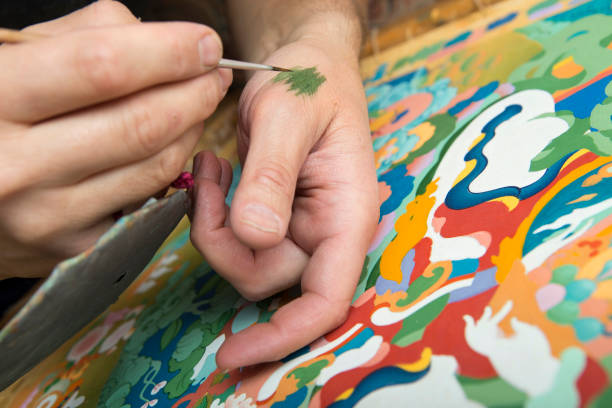 istock The artist paints a Buddhist icon 694039890