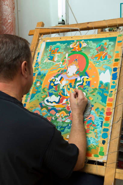 istock The artist paints a Buddhist icon 694039902