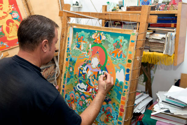 istock The artist paints a Buddhist icon 694039942
