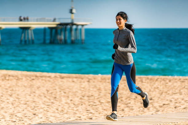 One man, a man who exercises in the early morning hours on the beach by the sea. Healthy lifestyle, tropical climate and care for your body.