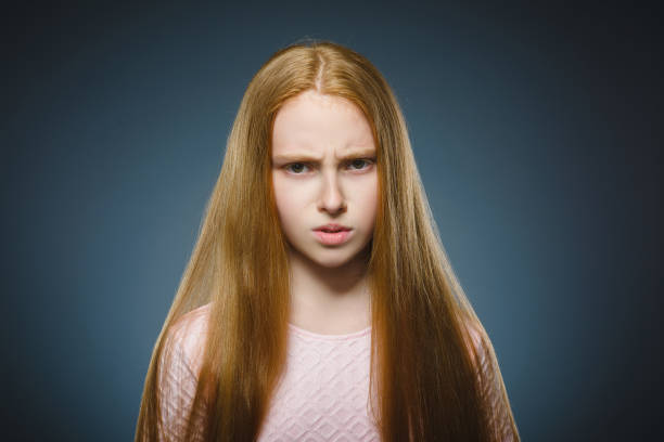 Closeup sad girl with worried stressed face expression stock photo