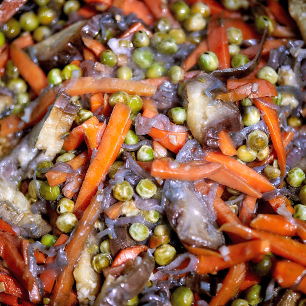 istock vegetables stir-fry in a wok, close up 694044704