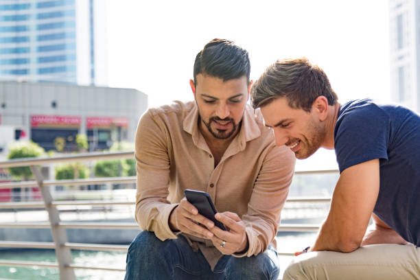 istock Colleagues planning to go for a night out after work 694047108
