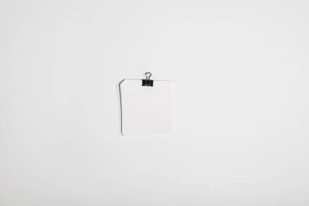 istock top view of little stack of white note papers with binder clip isolated on white 694050606