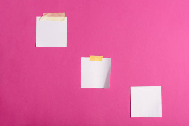 istock Close-up view of blank white sticky notes isolated on pink 694051318