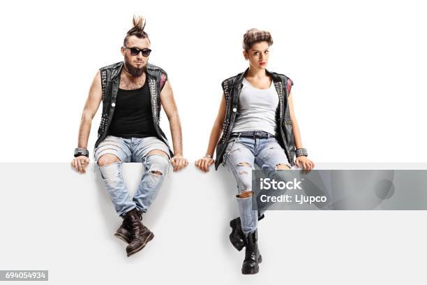 Male And Female Punkers Sitting On A Panel Stock Photo - Download Image Now - Punk - Person, Boot, Punk Music
