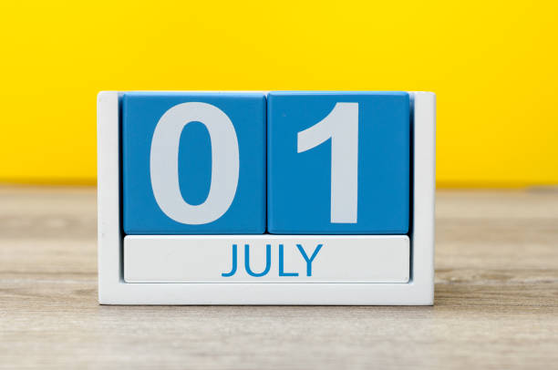 July 1st. Image of july 1, close-up wooden color calendar on yellow background. Summer day July 1st. Image of july 1, close-up wooden color calendar on yellow background. Summer day. june 1 stock pictures, royalty-free photos & images
