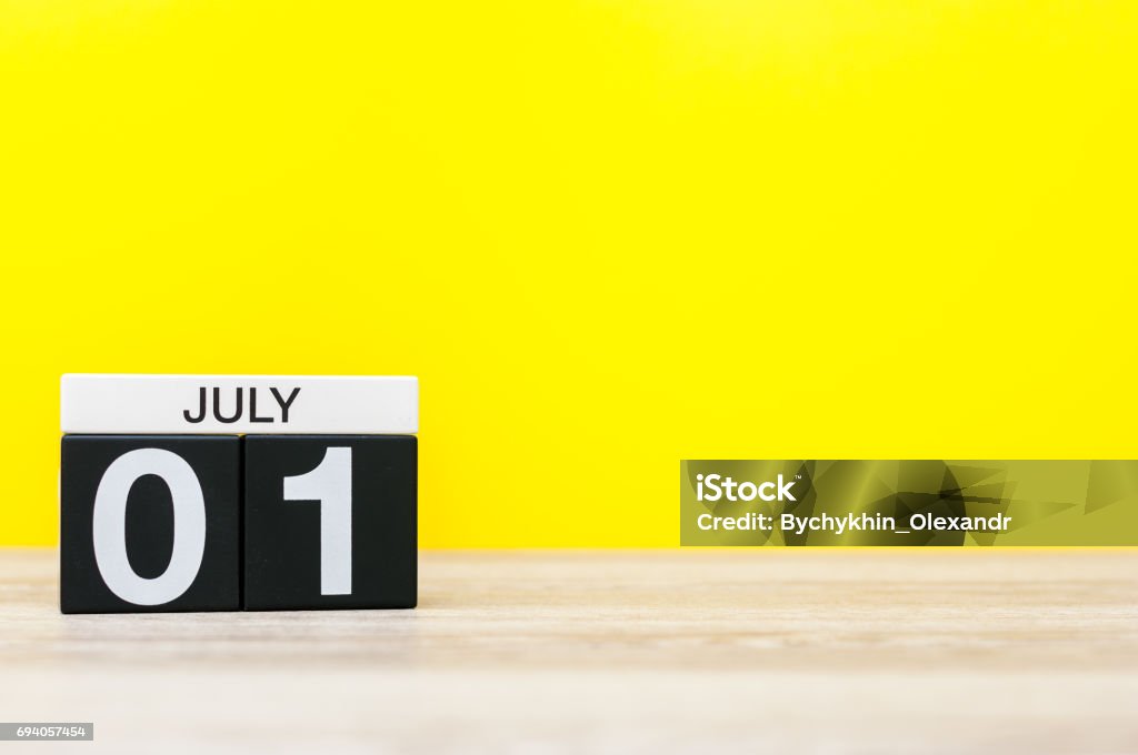 July 1st. Image of july 1, calendar on yellow background. Summer time. With empty space for text July 1st. Image of july 1, calendar on yellow background. Summer time. With empty space for text. Calendar Stock Photo