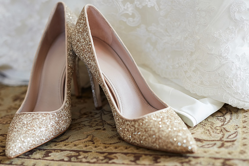 Closeup shot of a bride's wedding shoes