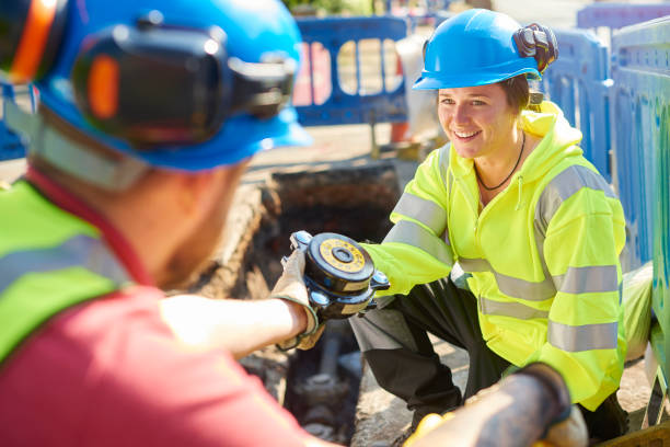 istock female civil engineer in gas trench 694061464
