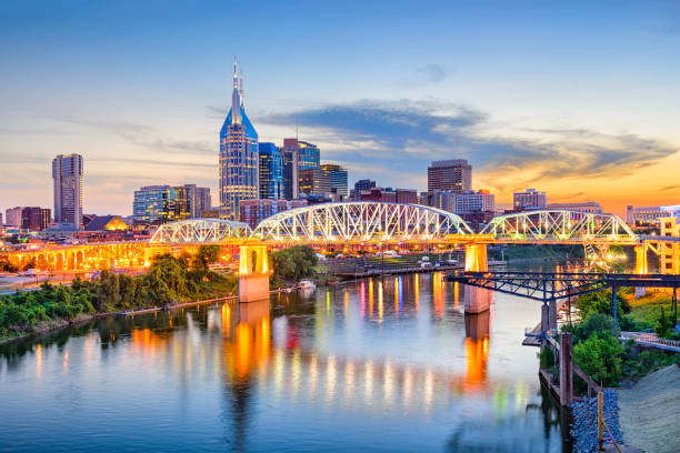 Nashville, Tennessee, USA Nashville, Tennessee, USA downtown skyline on the Cumberland River. financial district stock pictures, royalty-free photos & images