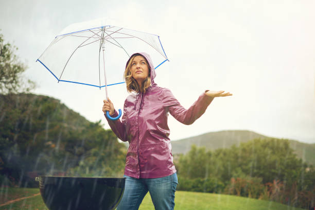 alles ist besser jetzt auf der suche - drenched raincoat rain clothing stock-fotos und bilder