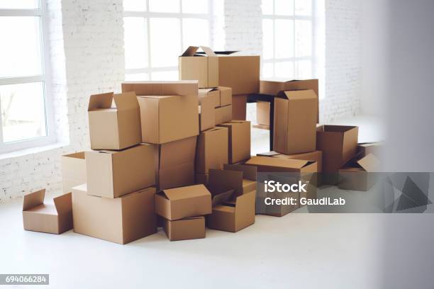 Carton Boxes Full Of Office Goods Stacked Stock Photo - Download Image Now - Office, Relocation, Box - Container