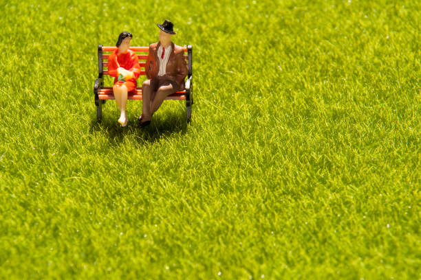 couple relaxing on a bench Dating, Embracing, Public Park, Springtime, Copy Space, miniature, love, rest, figure, healing figurine stock pictures, royalty-free photos & images