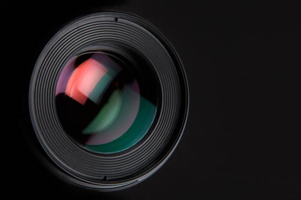 istock Camera lens close up isolated on dark background. 694071816