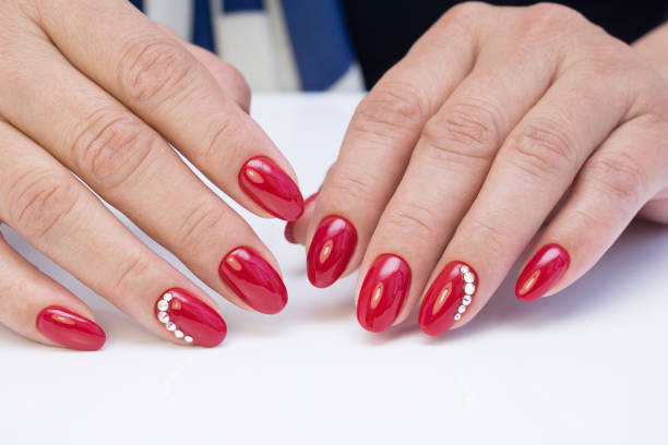 istock Hands with beautiful manicure. Natural nails with gel polish 694072548