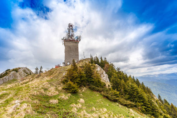 istock Telecommunication tower with satellite dishes 694075888