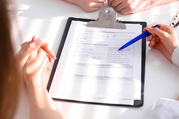 istock Doctor and patient are discussing something, just hands at the table 694076810