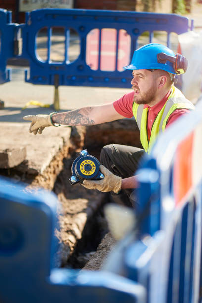 istock civil engineer replacing gas valves in the road 694076994