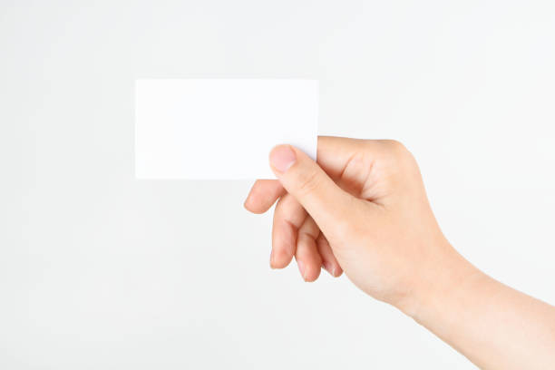 istock Hand holding a blank business card 694077650