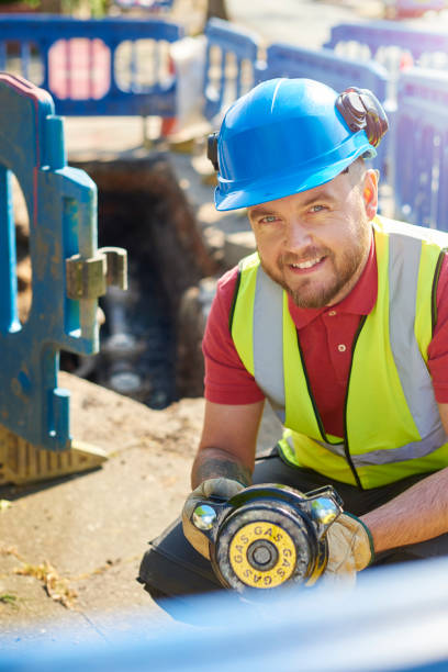 istock civil engineer replacing gas valves in the road 694079142
