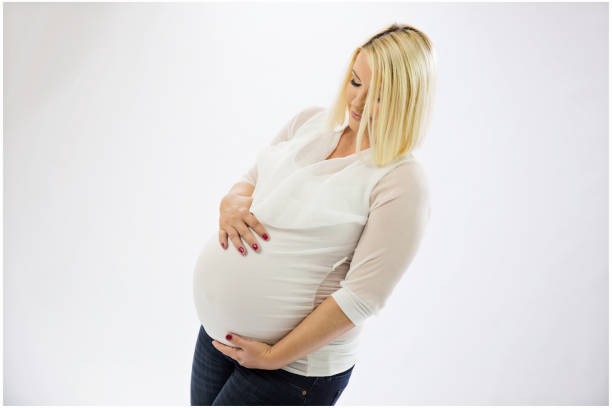 istock Beautiful pregnant young woman 694079398