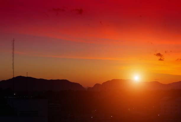istock Sunset in sky and cloud,  beautiful colorful  twilight  time with mountain silhouette 694082518