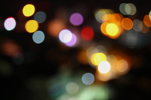 Abstract blurred bokeh in city night  colorful beautiful of traffic in Bangkok Thailand, with copy space Abstract blurred bokeh in city night  colorful beautiful of traffic in Bangkok Thailand, with copy space car city urban scene commuter stock pictures, royalty-free photos & images