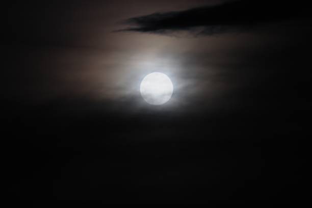 istock Full moon beautiful over dark  sky in night 694082726