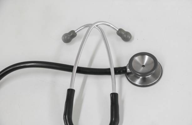 istock medical stethoscope, old used long-standing on the table with copy space :Select focus with shallow depth of field. 694083530