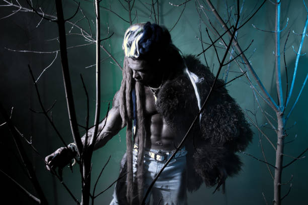 istock Muscular werewolf among the branches of the tree 694090934