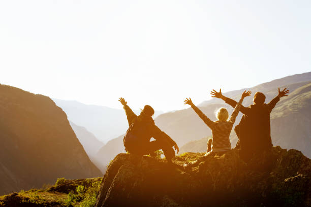 istock Happy friends at sunset in mountains range 694091114