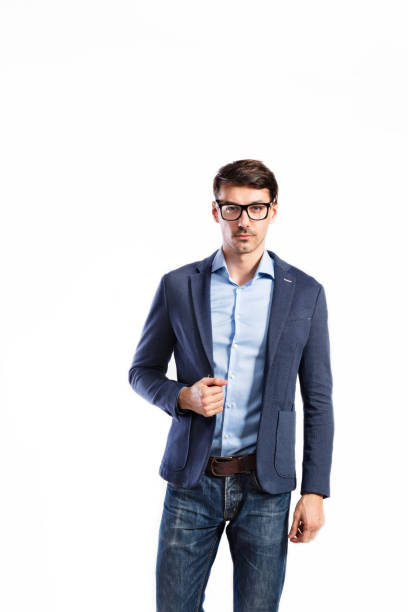 istock Handsome young man in blue jacket. Studio shot, isolated. 694091164