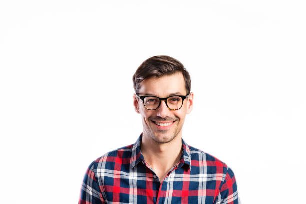 istock Handsome young man in checked shirt. Studio shot, isolated. 694091490