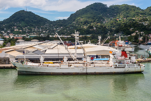 Victoria, Mahe island, Seychelles - December 17, 2015: Reefer ship Platte Reefer in import export and business logistic at the harbor of Port Victoria, Mahe island, Seychelles, Indian Ocean, East Africa.