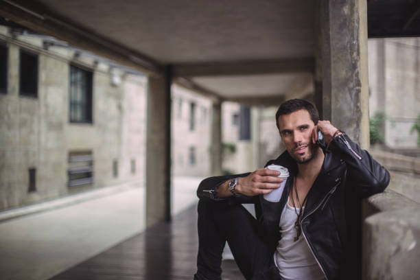 istock Talking over the phone on the street 694105044