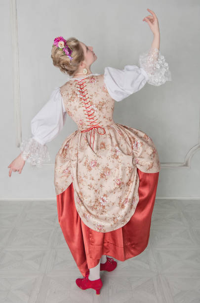 istock Beautiful woman in medieval dress. Back pose 694110244
