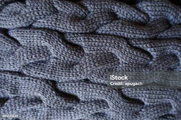 Close Up Of Plait Pattern On Grey Knit Fabric Stock Photo - Download Image Now - Arts Culture and Entertainment, Autumn, Backgrounds