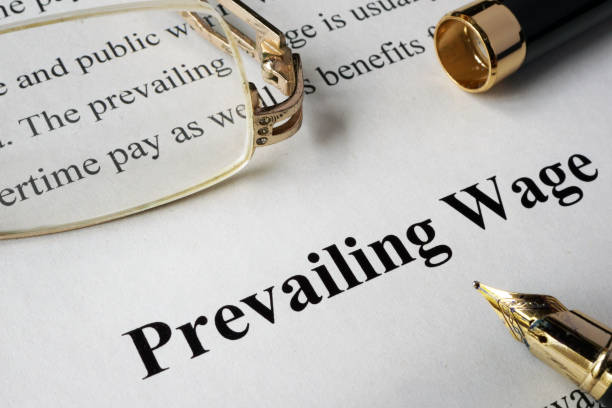 istock Prevailing wage concept written on a paper. 694121638