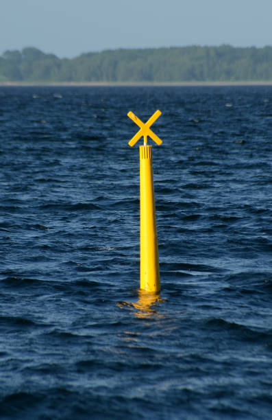 желтый буй - buoy anchored sea wave стоковые фото и изображения
