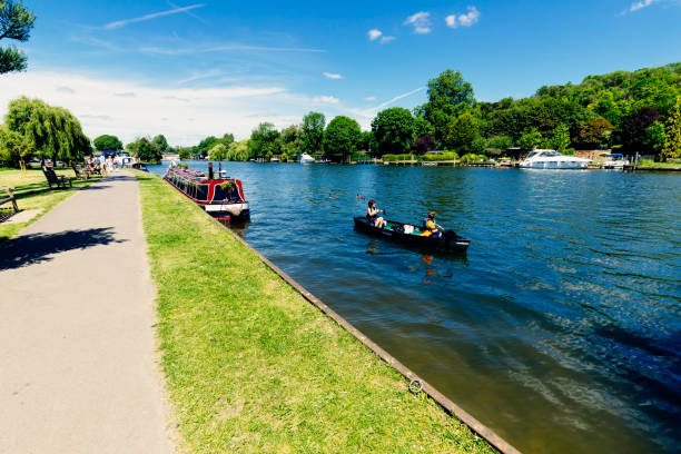 Kingston upon Thames, United Kingdom - April 2018: Oarsmen from Kingston Rowing Club training for canoe boat race in the River Thames, Kingston, England
