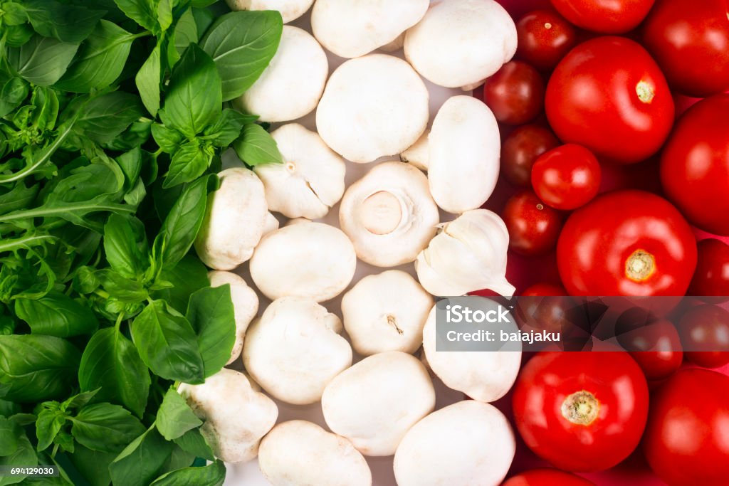 Italian food flag Italian flag from Italian food ingredients: basil, mushrooms, garlic, tomato. Italian Food Stock Photo