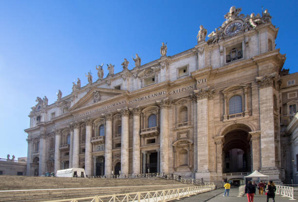 Night view of St. Peter’s Basilica and St. Peter´s square at Vatican city. The renaissance basilica style completed 1626 is the main center of the Roman Catholic Apostolic Church, burial site of Saint Peter the apostle and seat of the Pope.  Thousands of pilgrims from all over the world daily visit the Basilica.