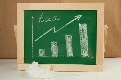graph showing rise in tax drawn over with chalk